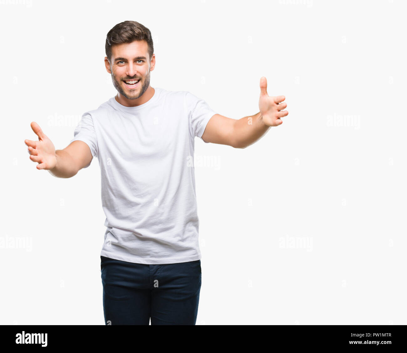 Young Handsome Man Over Isolated Background Looking At The Camera Smiling With Open Arms For Hug Cheerful Expression Embracing Happiness Stock Photo Alamy