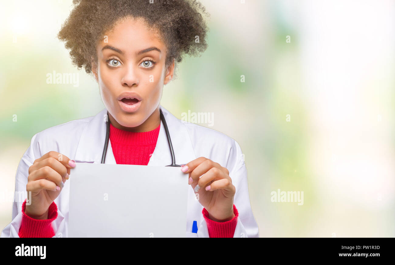 Afraid Paper Young afro american doctor woman holding blank paper over isolated ...