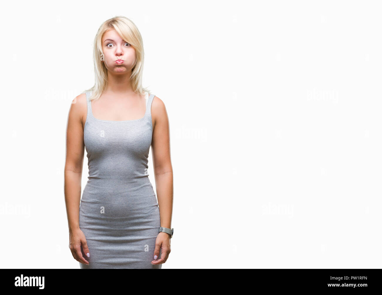 Puffing Cheeks Young beautiful blonde woman over isolated background puffing cheeks ...