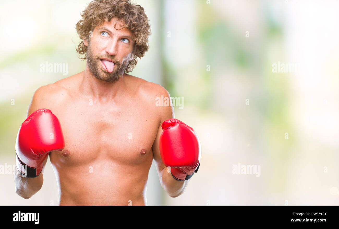 Handsome hispanic boxer man wearing boxing gloves over isolated Handsome hispanic boxer man wearing boxing gloves over isolated