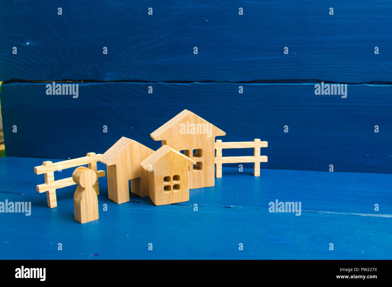 Three houses on a blue background. Buying and selling of real estate, construction. Minimalism. for presentations. real estate market. Apartments and  Stock Photo