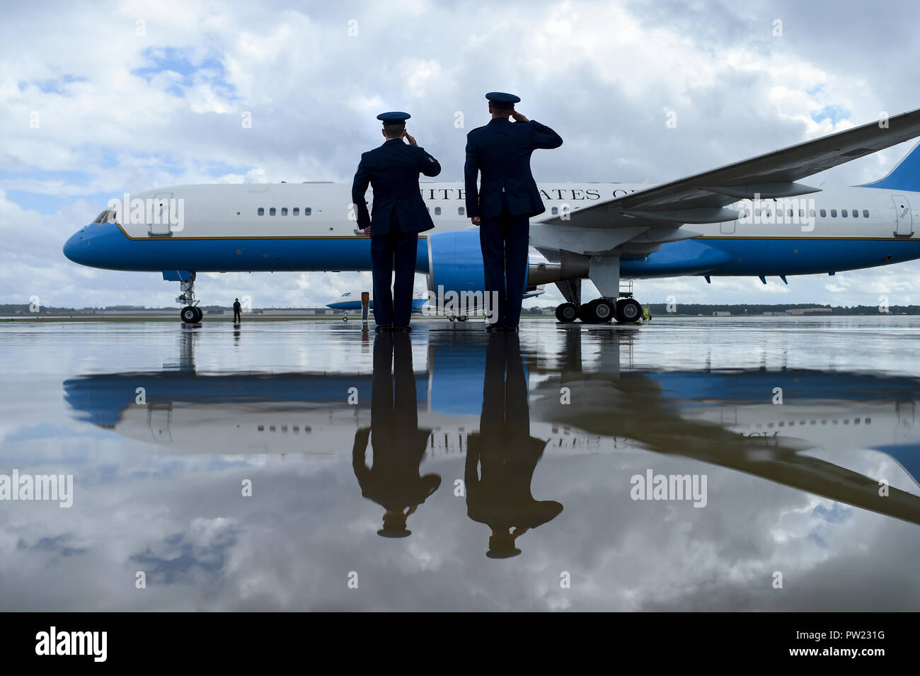 Staff Sgt. Joseph Shank, (left) and Maj. John Querl render salutes as Vice President Mike Pence departs Joint Base Andrews, Md., Oct. 10, 2018. The 89th Airlift Wing provides global Special Air Mission airlift, logistics, aerial port and communications for the president, vice president, cabinet members, combatant commanders and other senior military and elected leaders as tasked by the White House, Air Force chief of staff and Air Mobility Command. (U.S. Air Force photo/Staff Sgt. Kenny Holston) Stock Photo