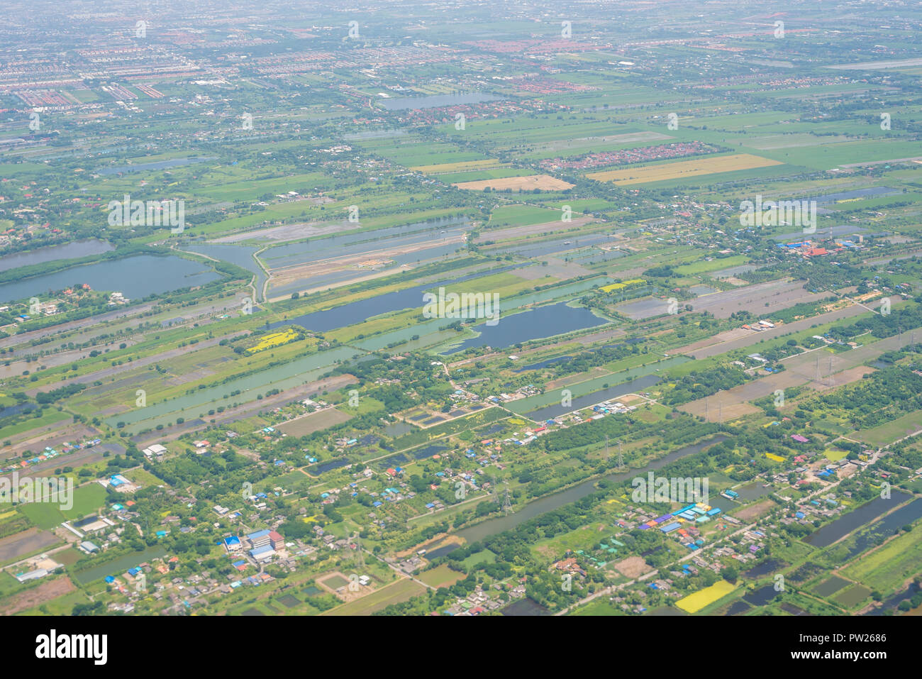 Encroachment of housing estate which affect the environment and agricultural property Stock Photo