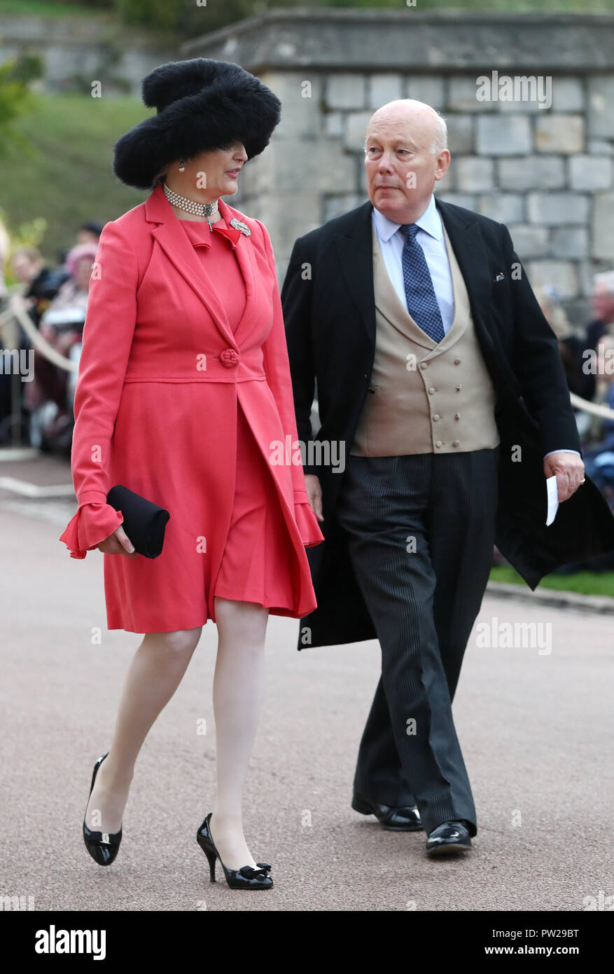 Emma Joy Kitchener and Julian Fellowes arrive at the grounds of Windsor  Castle during the wedding of Princess Eugenie to Jack Brooksbank at St  George's Chapel in Windsor Castle Stock Photo -