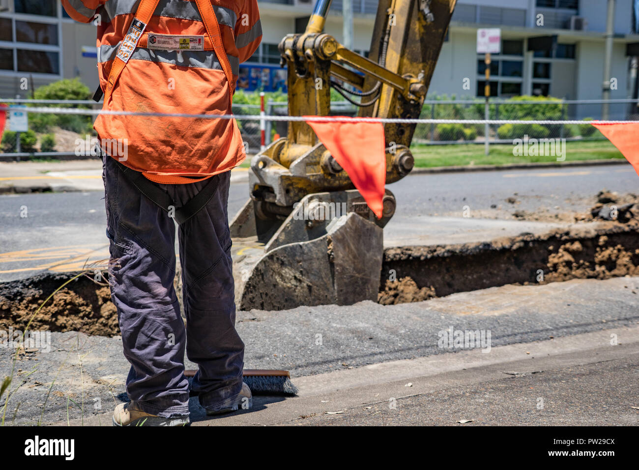 Workers digging up the road to lay new pipes Stock Photo Alamy