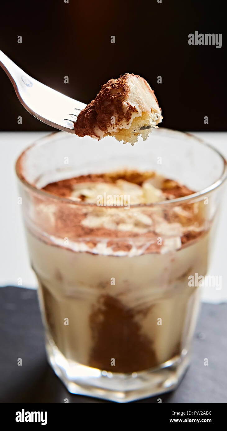 Tiramisu in glass, traditional coffee flavored Italian dessert made of