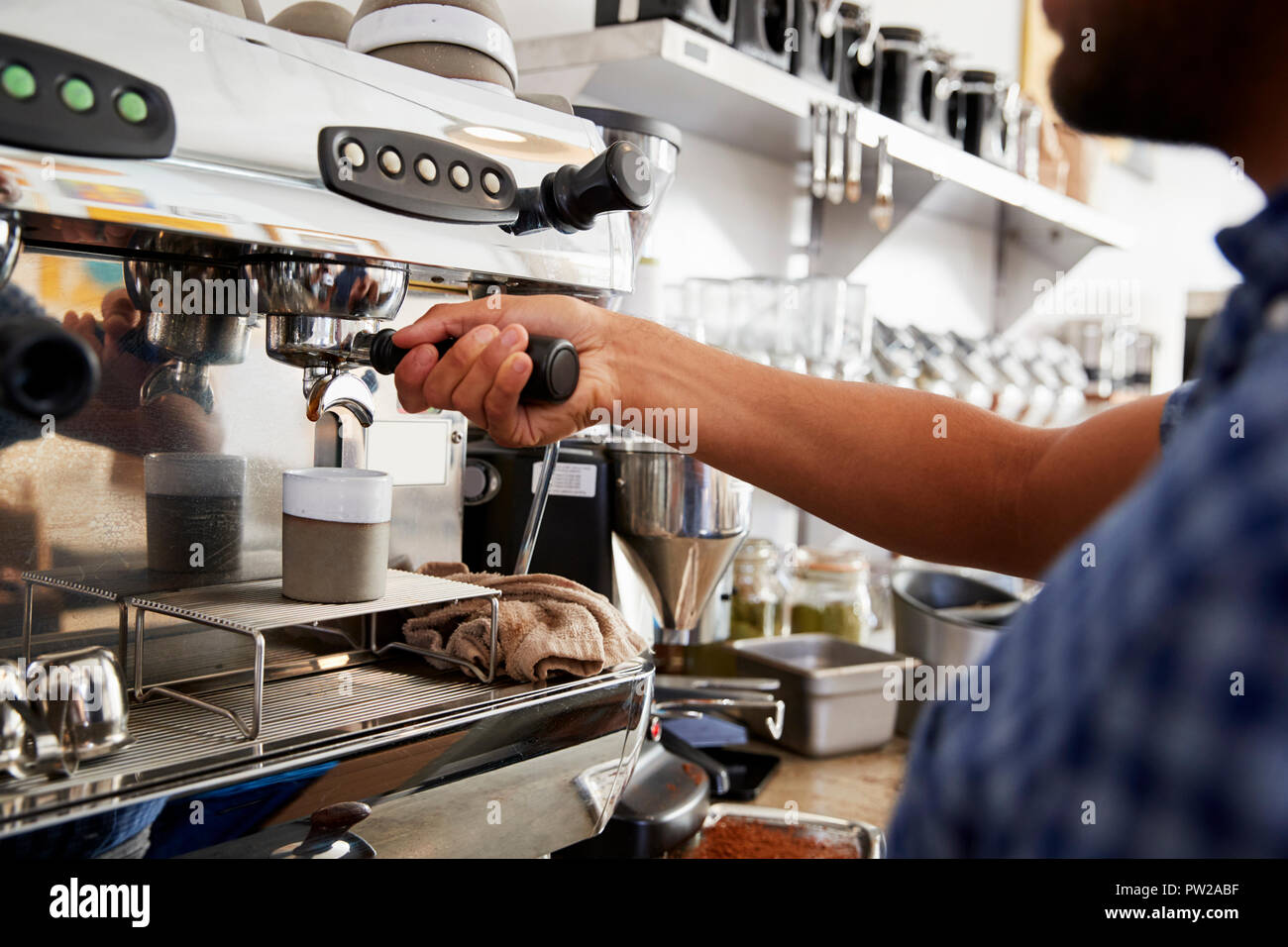 Professional barista preparing coffee in aeropress Stock Photo by Sonyachny