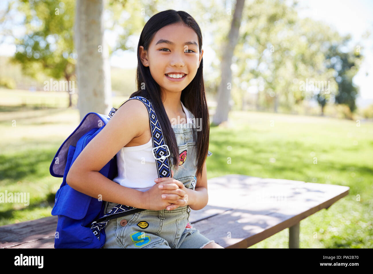 Young Asian smiling schoolgirl looking to camera, portrait Stock Photo