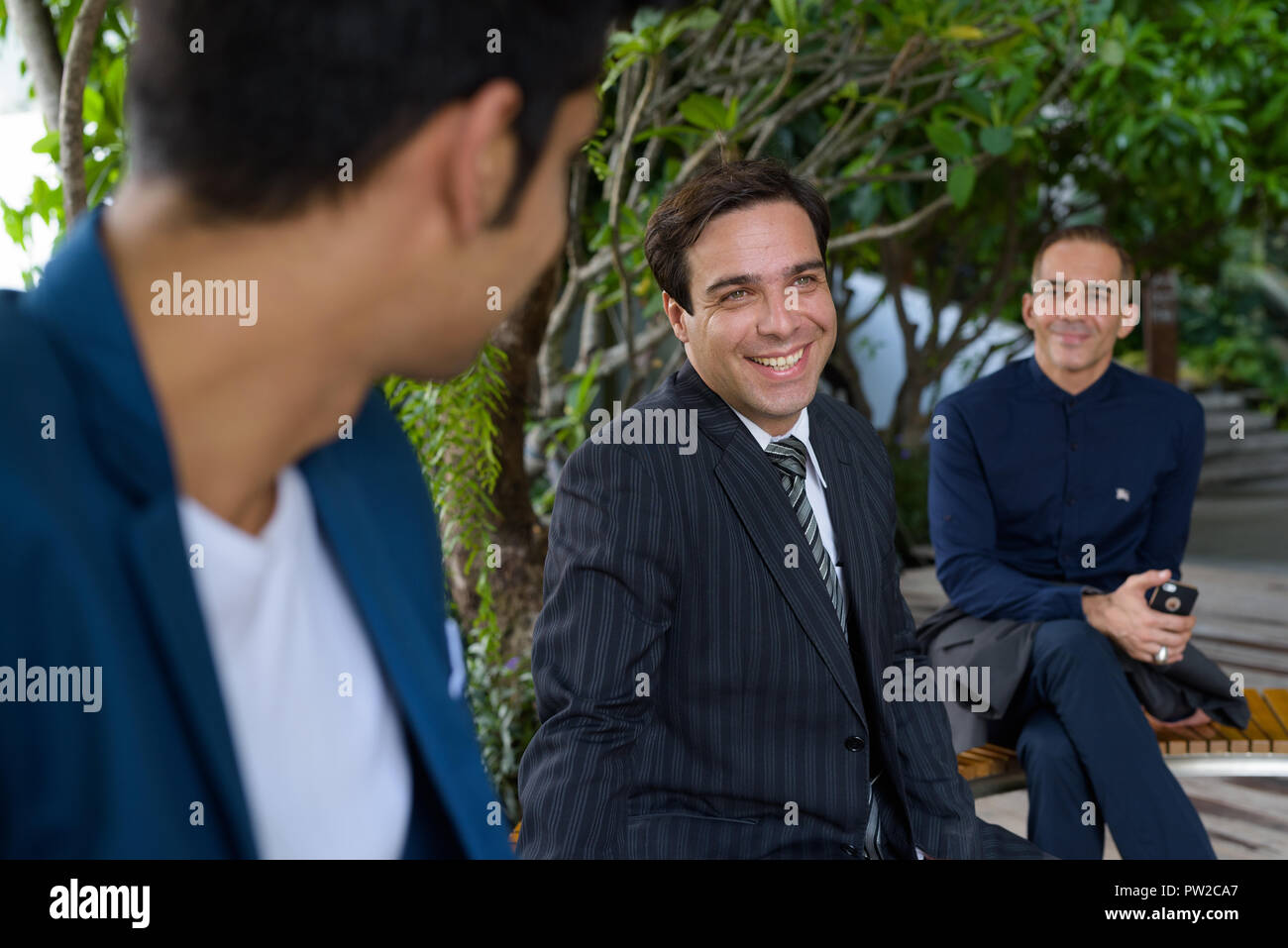 Persian businessmen exploring the city of Bangkok together  Stock Photo