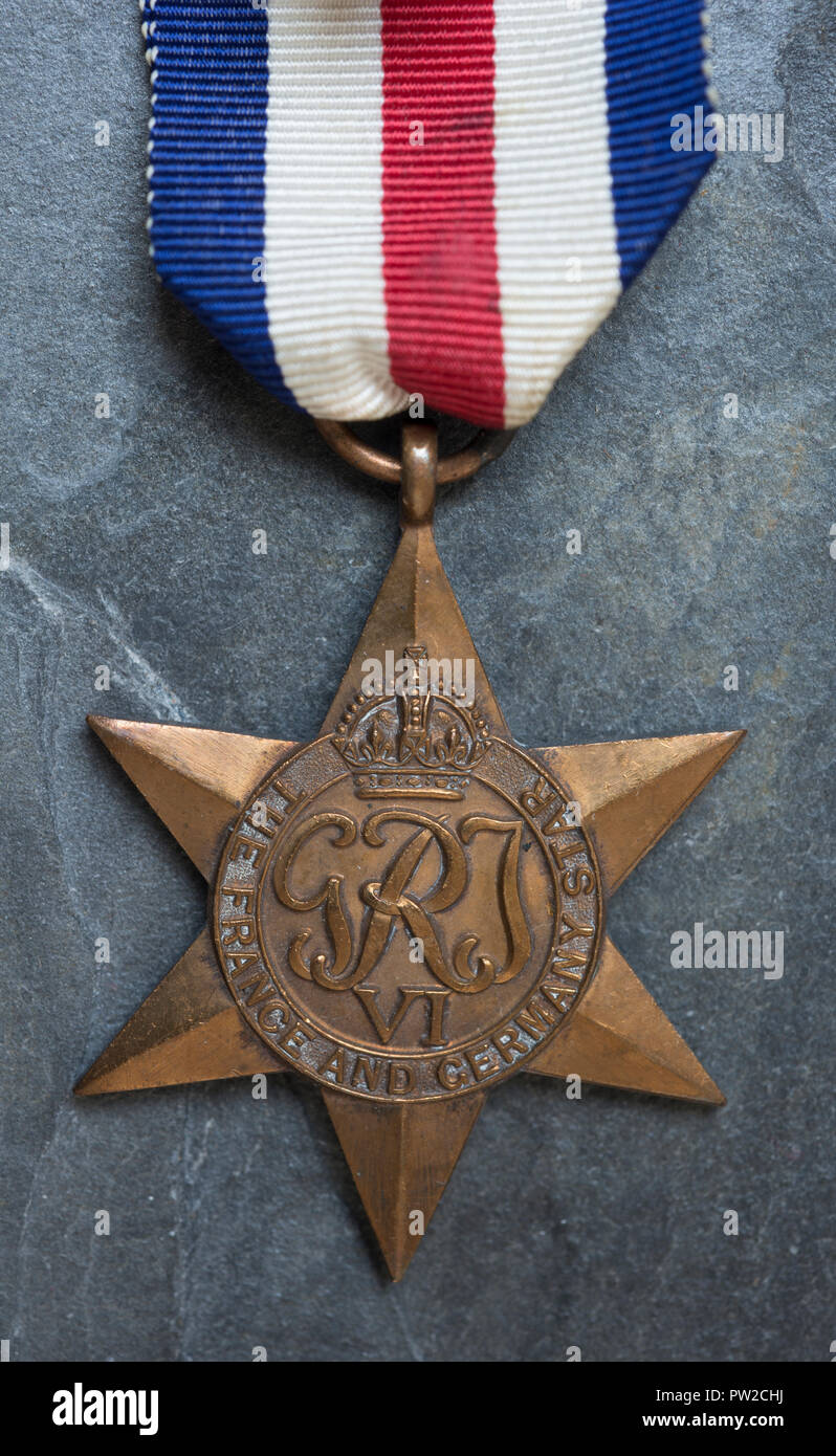 WW2 British Medal, the France and Germany Star on a slate background. Stock Photo