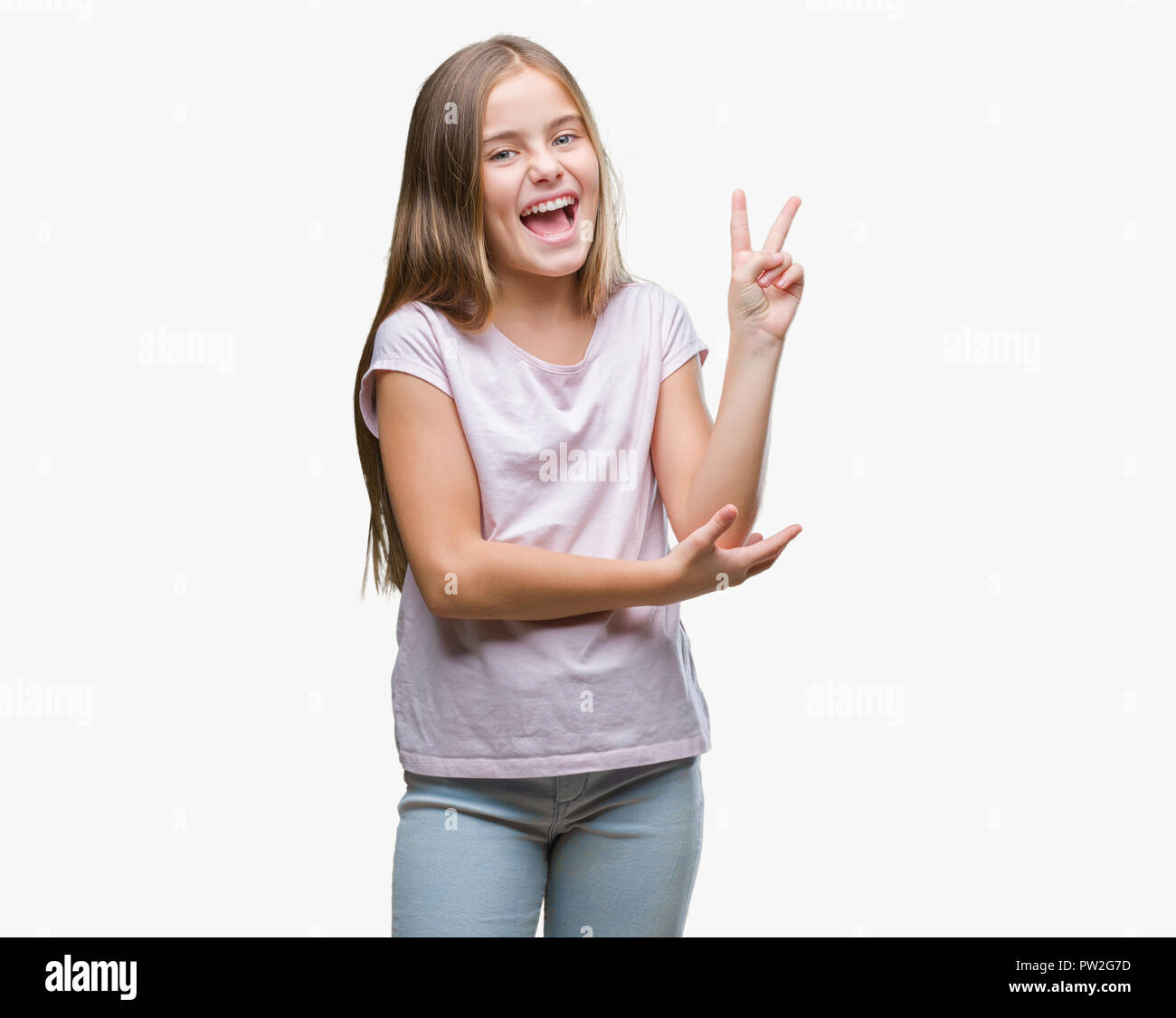 Free Photo  Young sporty woman winking and smiling showing two fingers  standing over purple wall