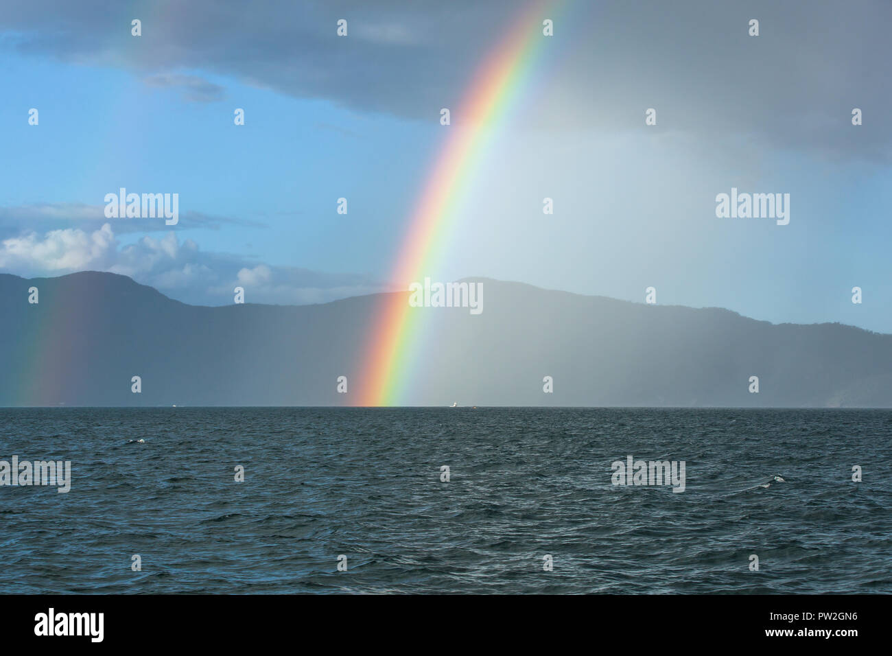 Rainbow over Water near False Cape, Cairns, Australia Stock Photo