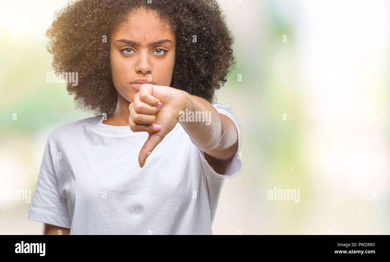Young afro american woman over isolated background looking unhappy and ...