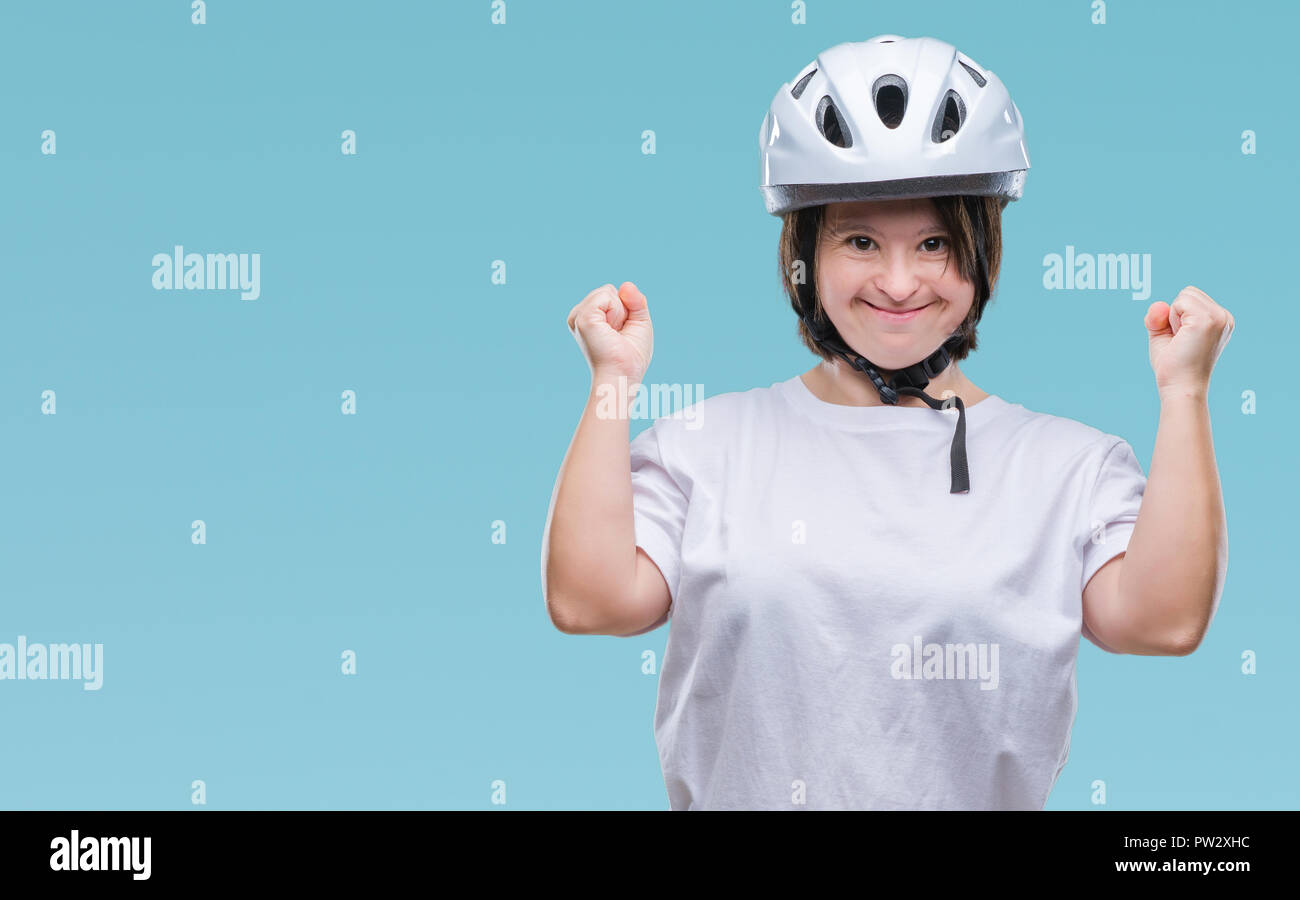 Young adult cyclist woman with down syndrome wearing safety helmet over
