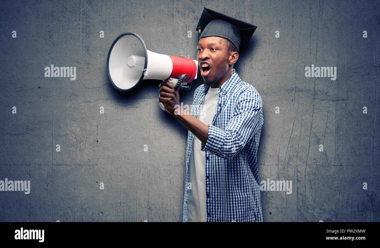 Young african graduate student black man communicates shouting loud ...