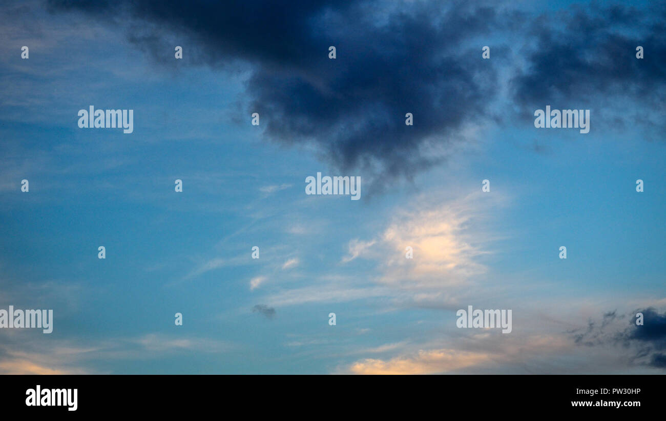 Blue sky with black clouds in the afternoon Stock Photo