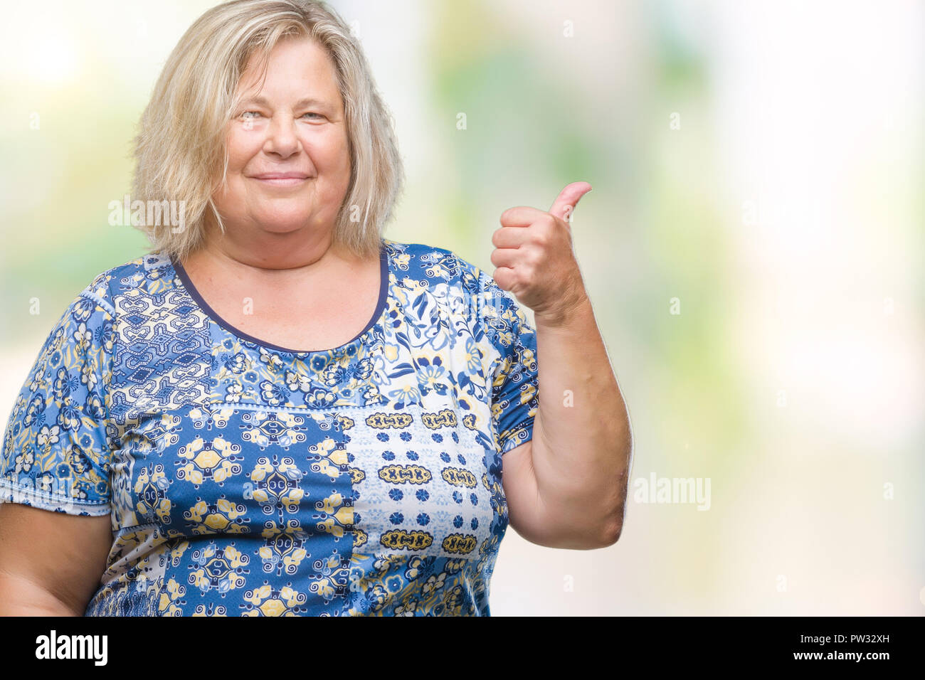 Senior plus size caucasian woman over isolated background smiling with ...