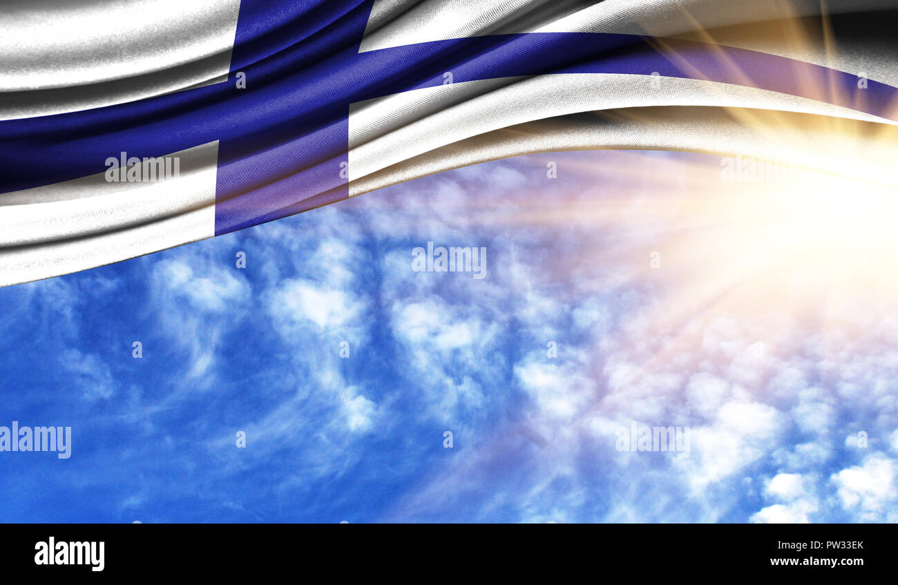 the flag of Finland in the rays of the summer sun, in the sky ...