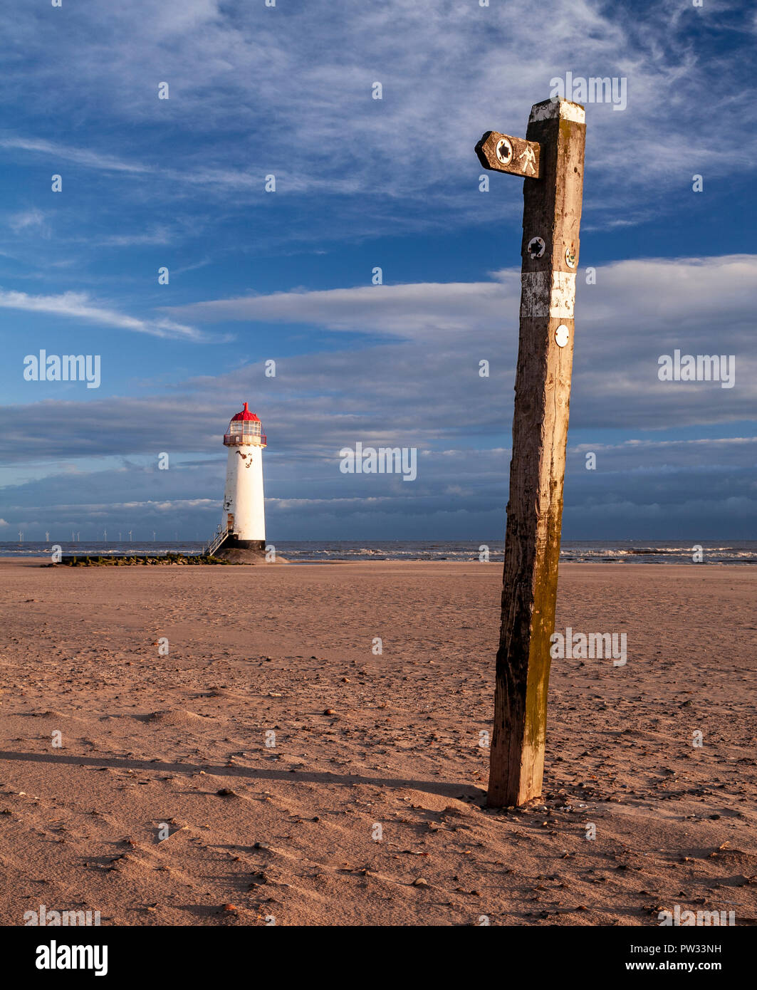Point of Ayr lighthouse on Talacre beach, North Wales coast at low tide on a sunny day Stock Photo