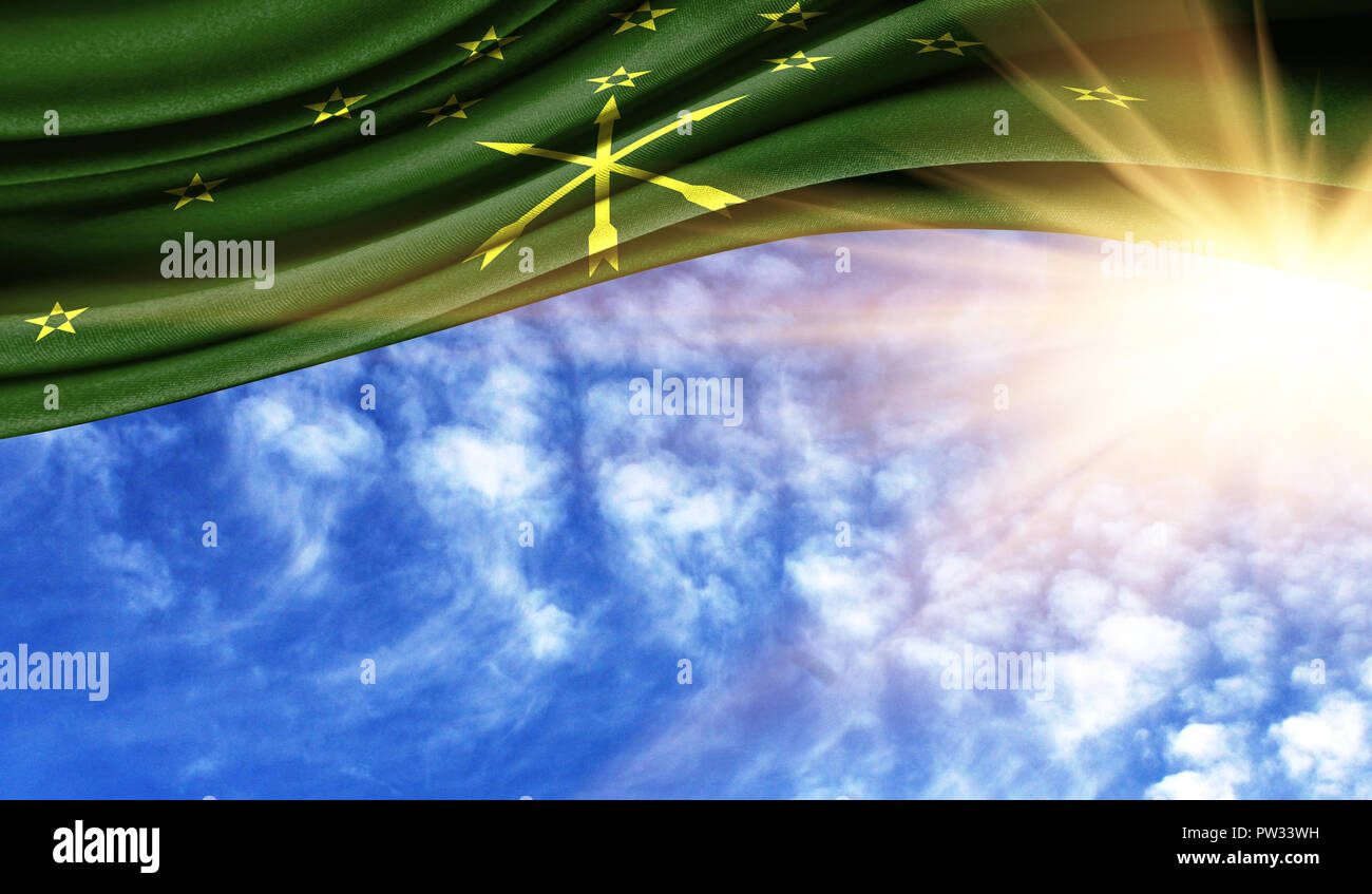 the flag of Adygea in the rays of the summer sun, in the sky, photography has a good place for your text. Stock Photo