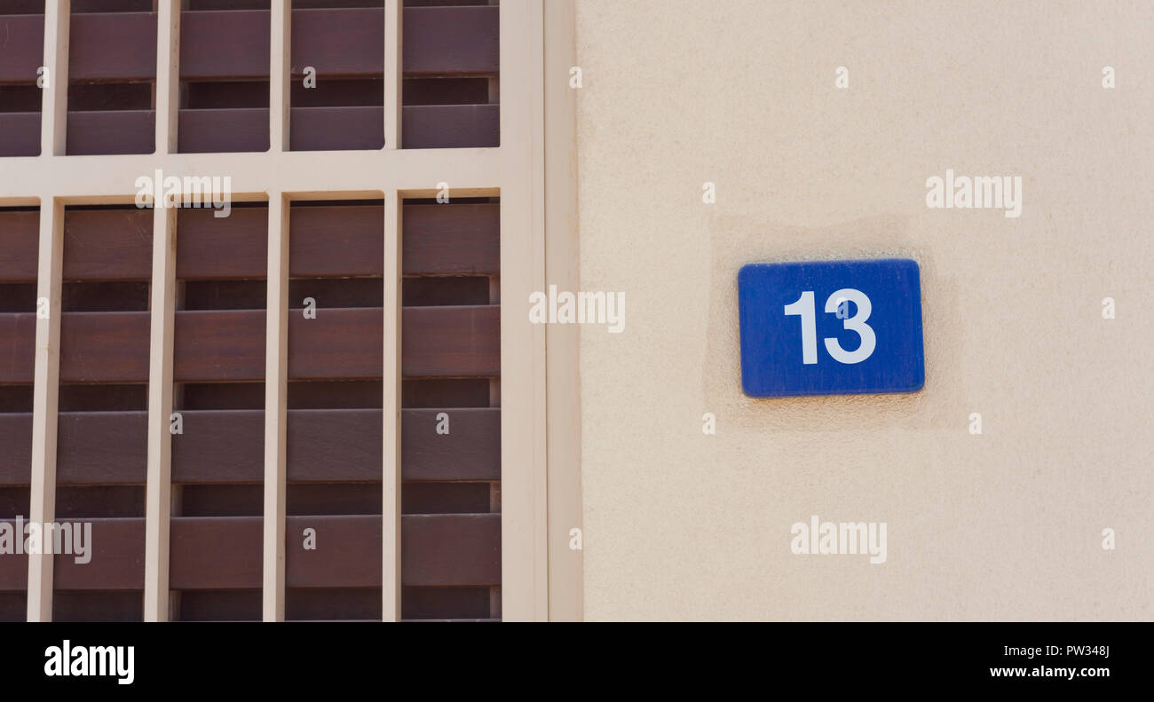 number 13 sign on the wall, bad luck concept Stock Photo Alamy