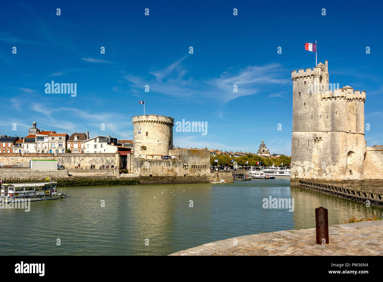 St Nicolas Tower (Tour Saint Nicolas) and The Chain Tower (Tour de la Chaine) at the entrance to the ancient port of La Rochelle, Charente Maritime,   Stock Photo