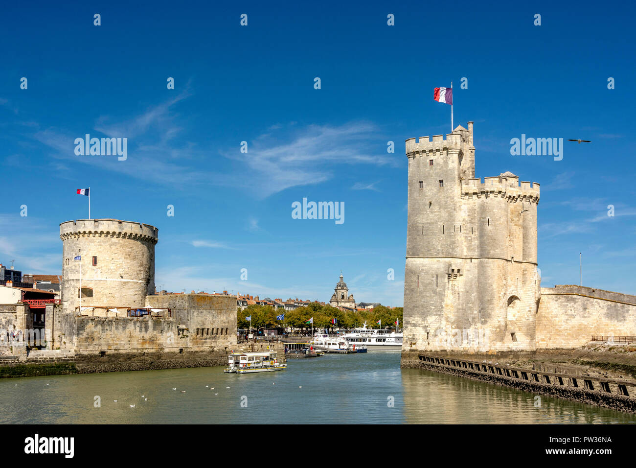 St Nicolas Tower (Tour Saint Nicolas) and The Chain Tower (Tour de la Chaine) at the entrance to the ancient port of La Rochelle, Charente Maritime,   Stock Photo