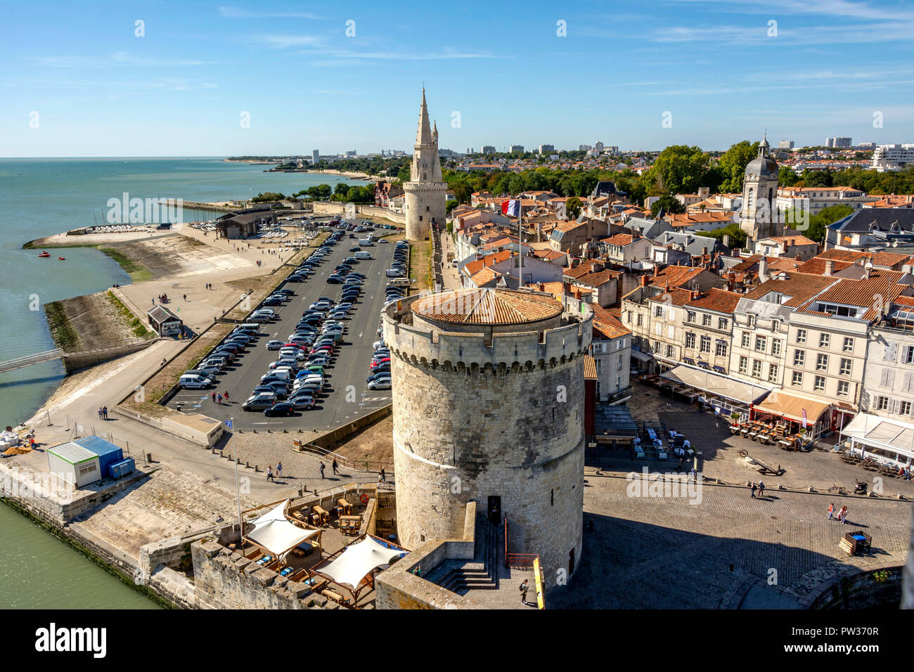 The Lantern Tower (Tour de la Lanterne) and The Chain Tower (Tour de la Chaine) at the entrance to the ancient port of La Rochelle, Charente Maritime, Stock Photo