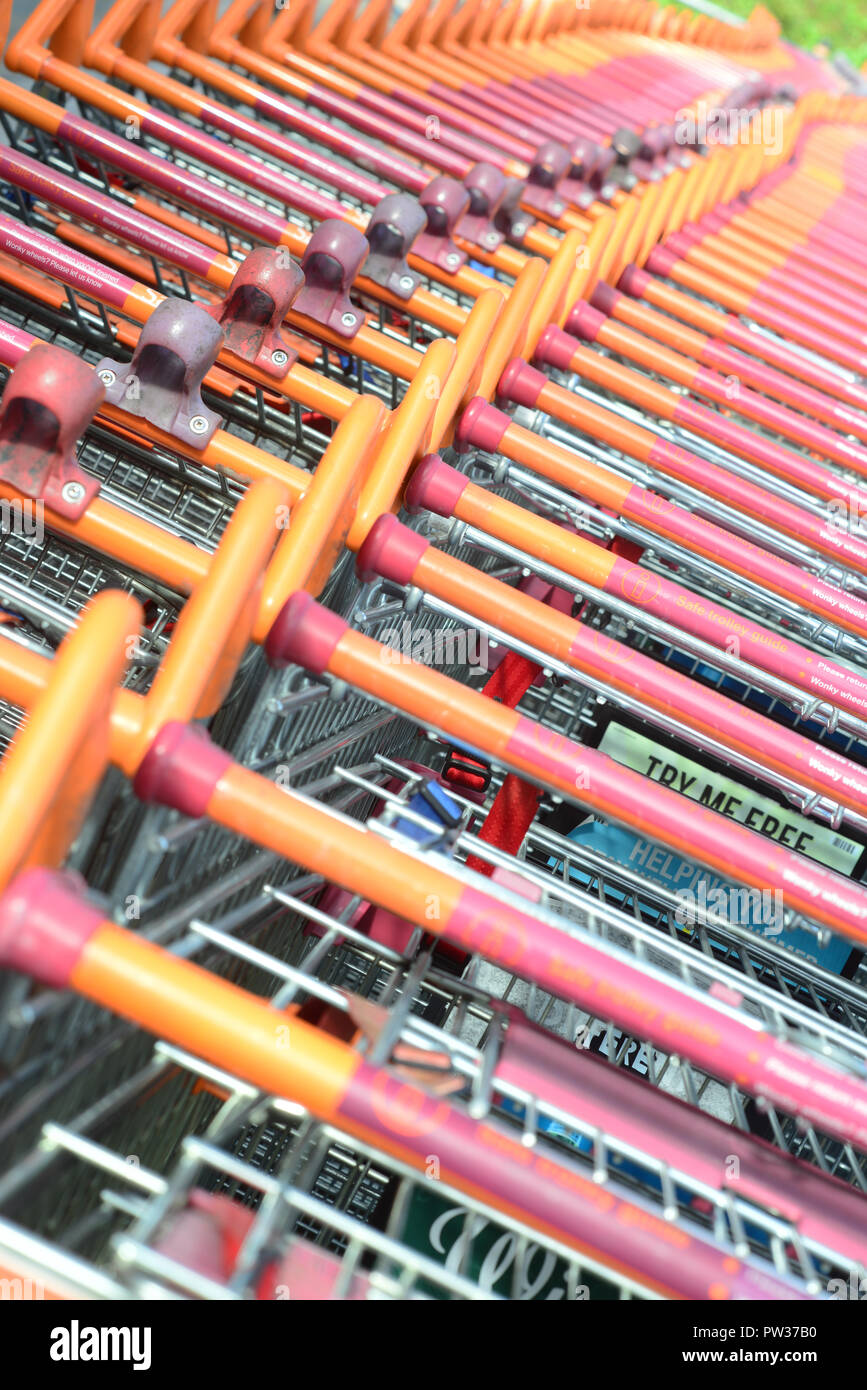 close up of rows of hundreds of shopping trolleys at supermarket united kingdom Stock Photo