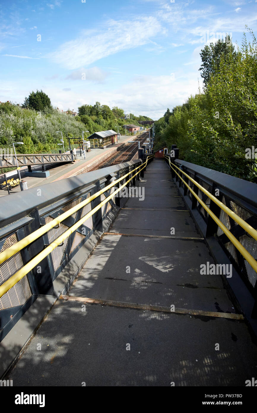 access ramp down to hunts cross train railway station Liverpool Merseyside England UK Stock Photo
