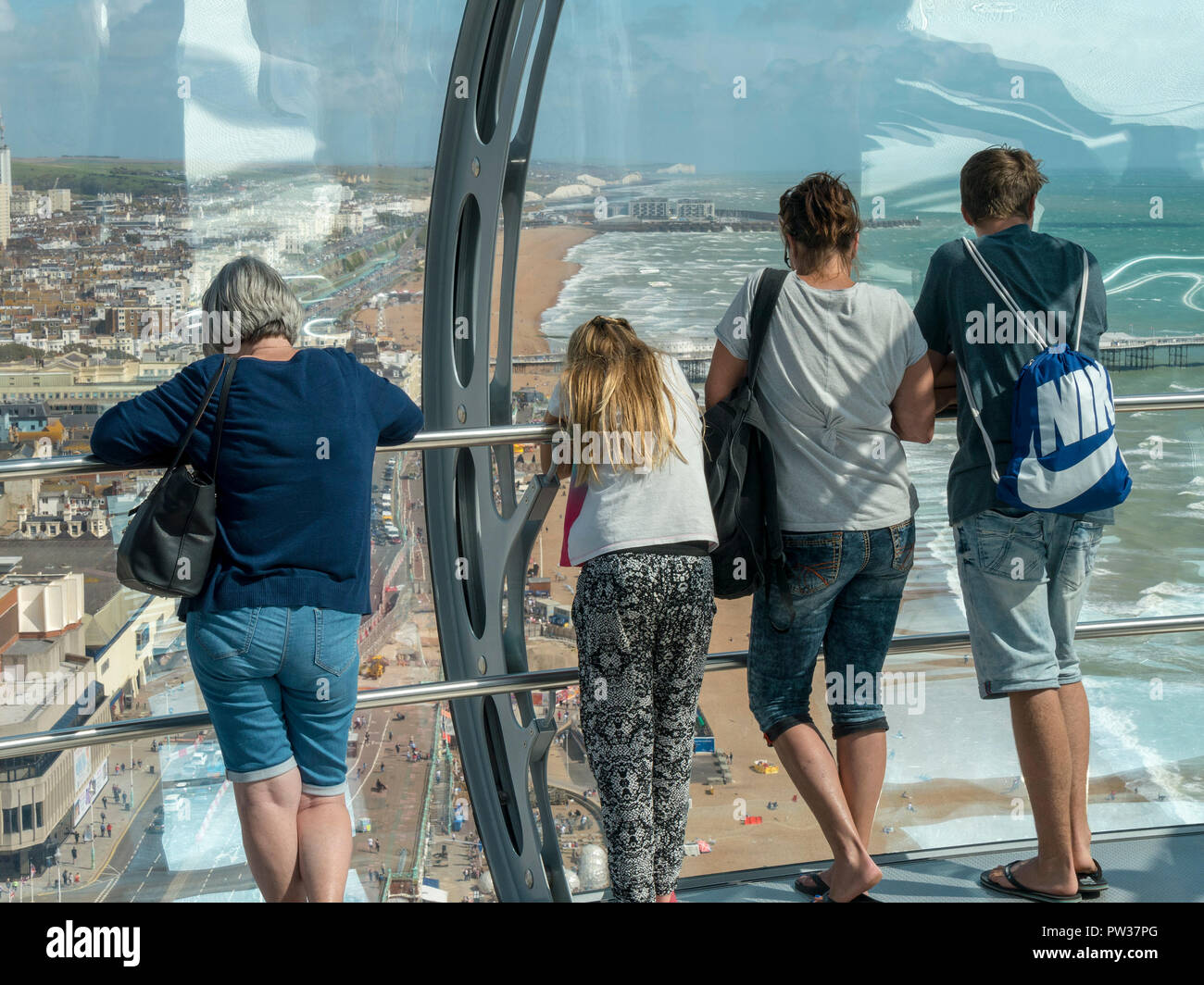 Sightseers looking at the view from British Airways i360 observation pod, Brighton, East Sussex, England, UK Stock Photo