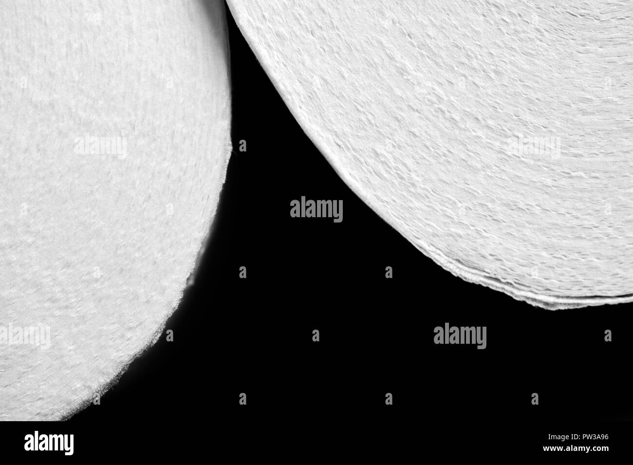 Toilet paper with heavy contrast creating abstract patterns in black