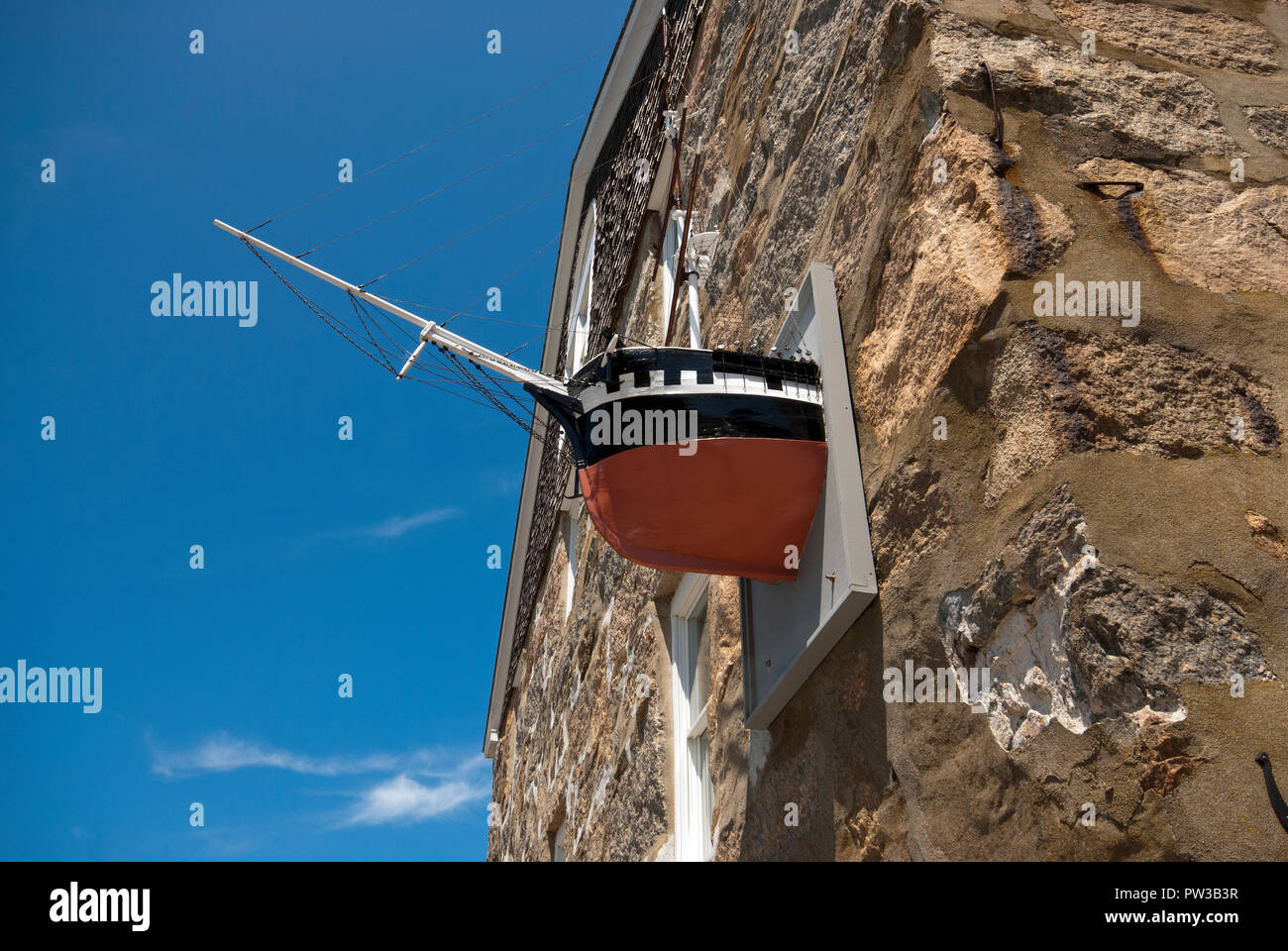 Bow of the model ship in the wall of Candle House historic building in Woods Hole, Falmouth