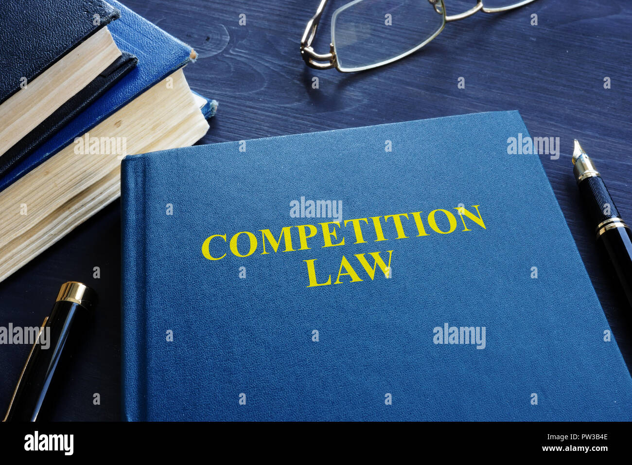 Competition law and pen on a table. Stock Photo