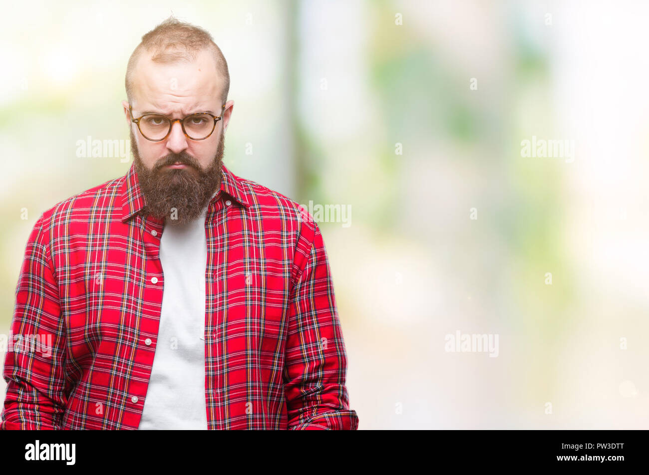 Young caucasian hipster man wearing glasses over isolated background depressed and worry for distress, crying angry and afraid. Sad expression. Stock Photo