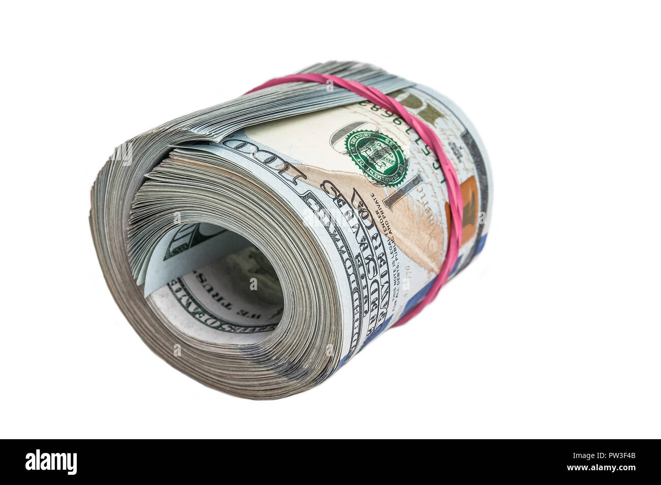A large roll of one hundred dollar bills on a white background. Stock Photo