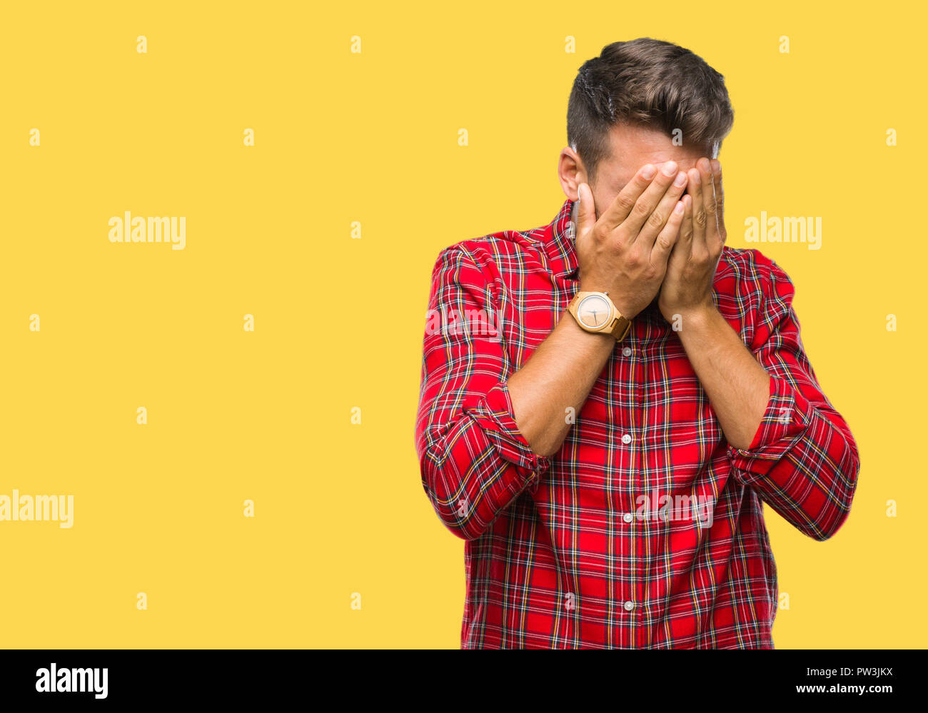 Young handsome man over isolated background with sad expression covering face with hands while crying. Depression concept. Stock Photo