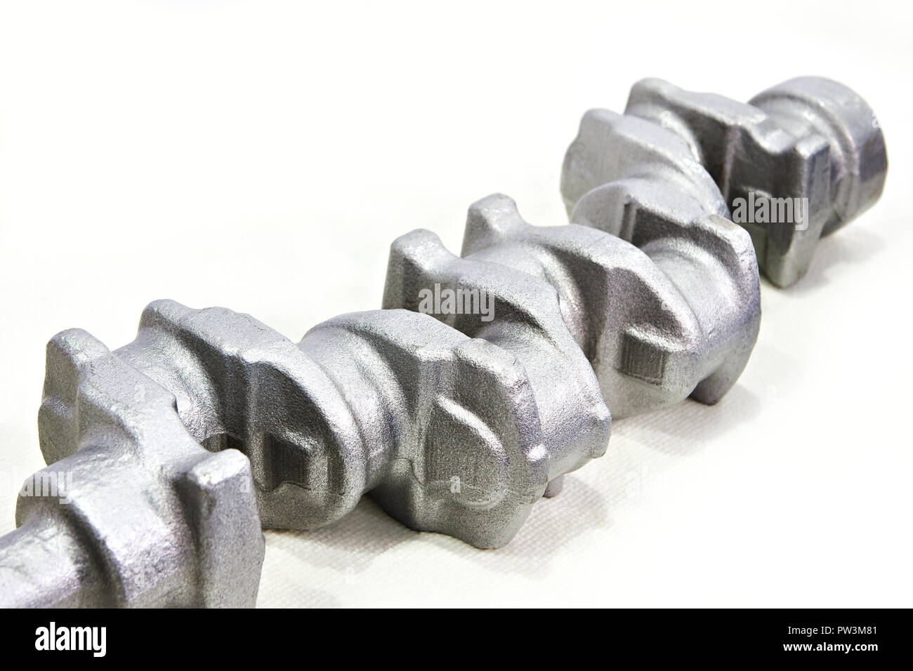 Stamped engine crankshaft on white Stock Photo
