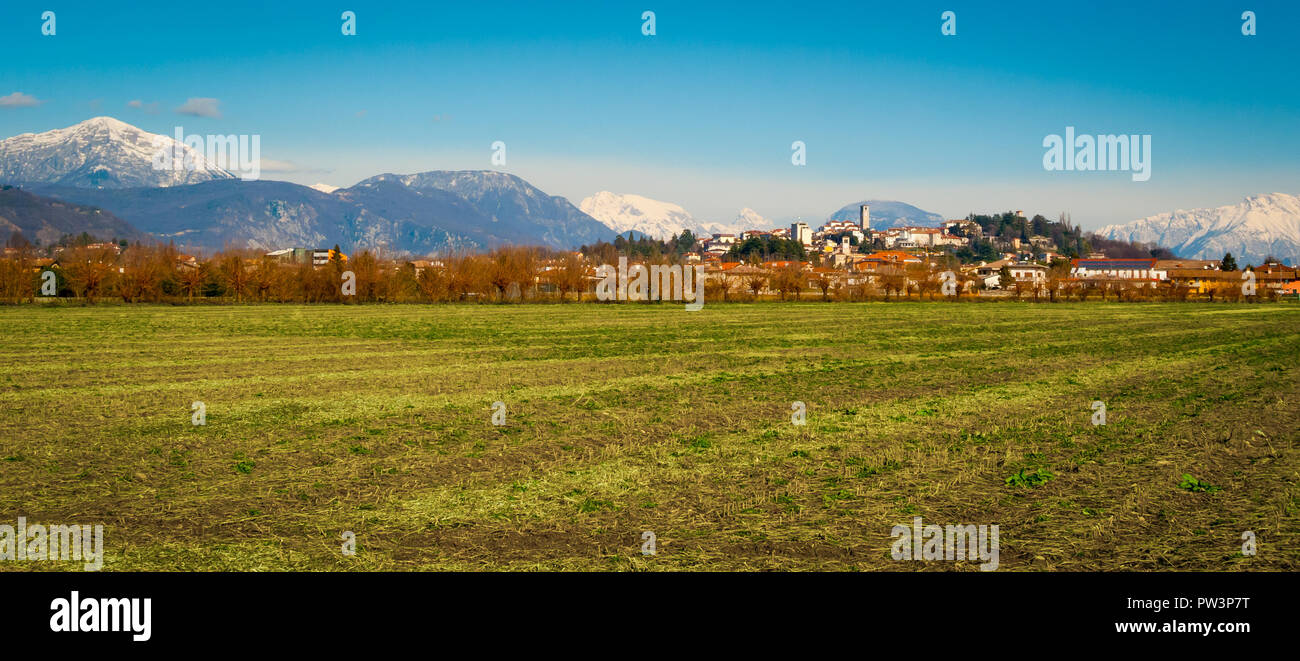 Panoramic view of San Daniele del Friuli from the surrounding fields on a sunny winter day, Friuli Venezia-Giulia, Italy Stock Photo