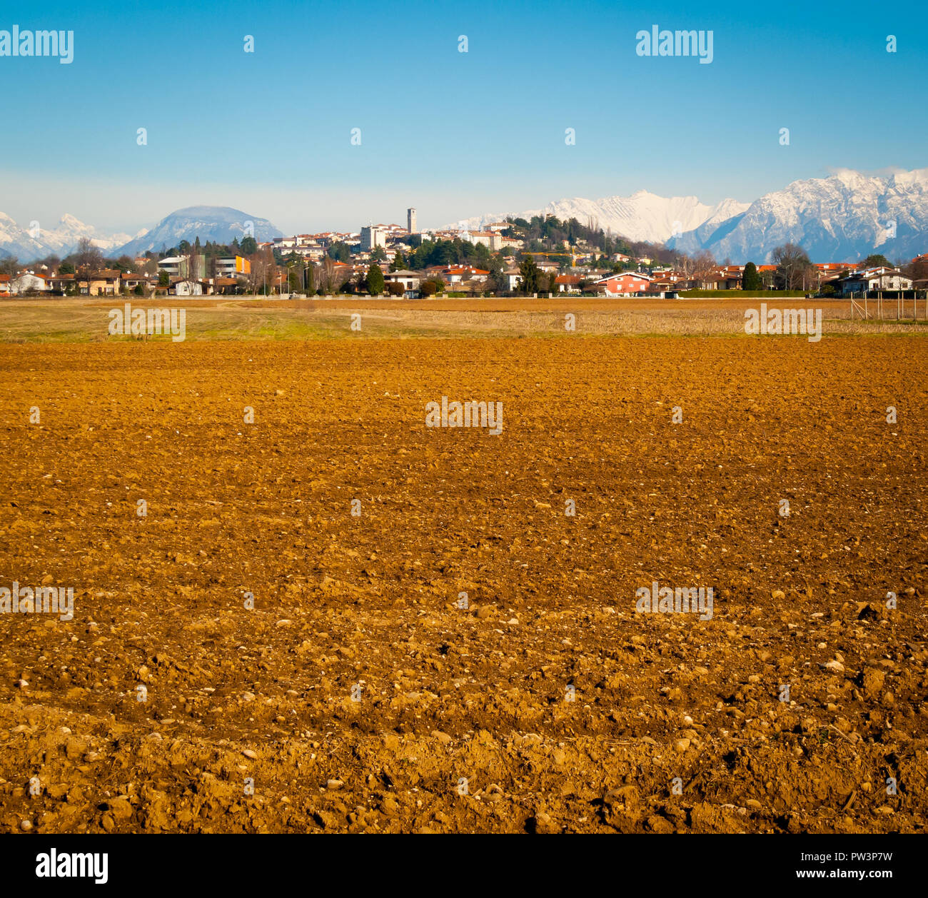 View of San Daniele del Friuli from the surrounding fields on a sunny winter day, Friuli Venezia-Giulia, Italy Stock Photo