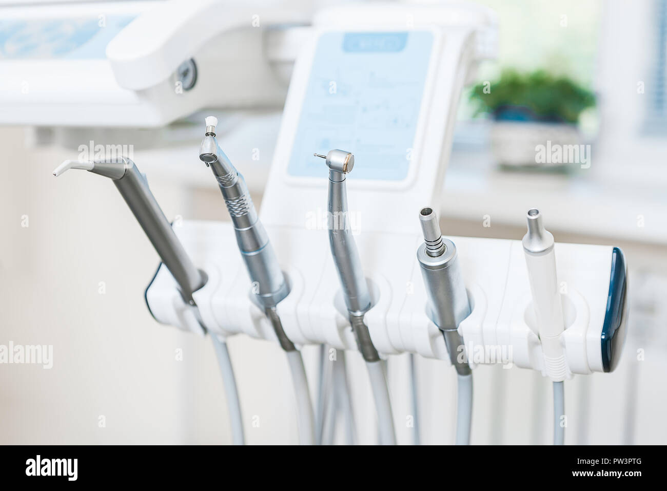 Different dental instruments and tools in a dentists office. Indoor Stock Photo