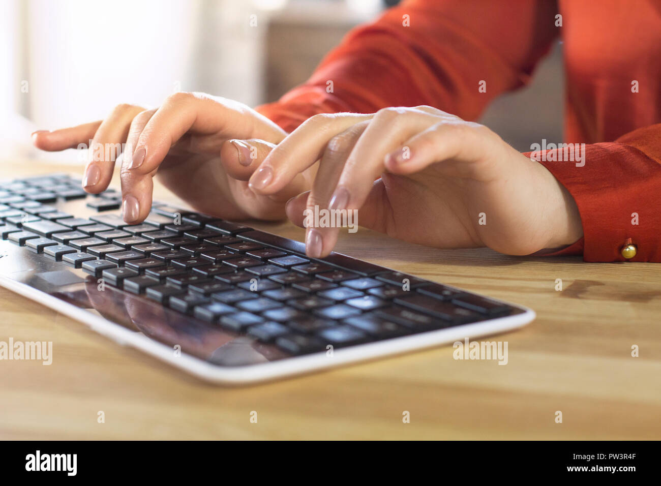 Woman typing on keyboard. Stock Photo