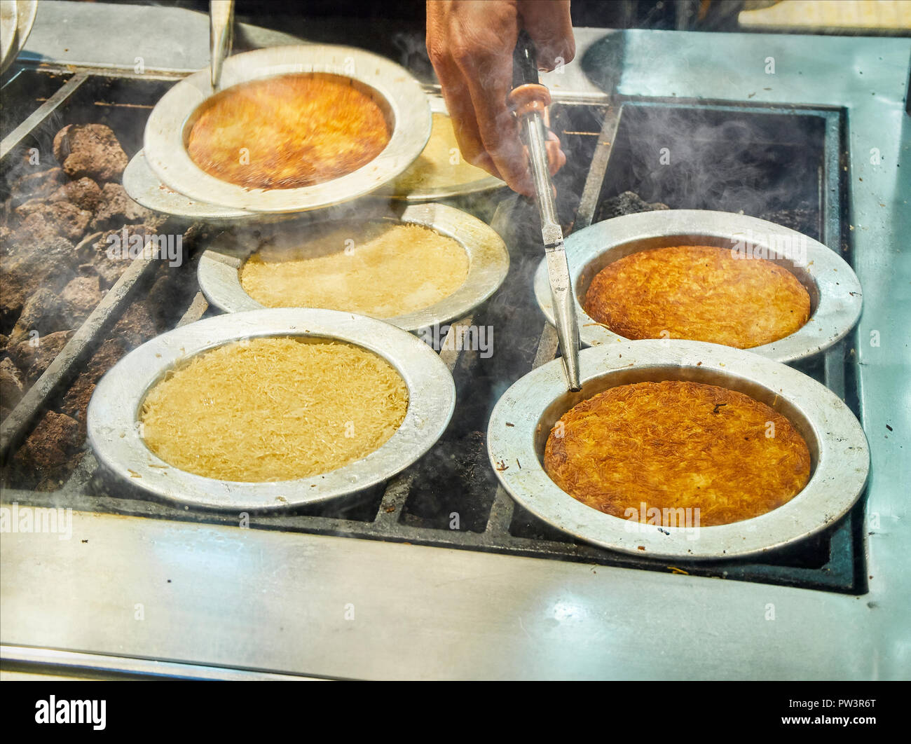 Kunefe, also known as Kenafeh, a traditional Arab dessert made with