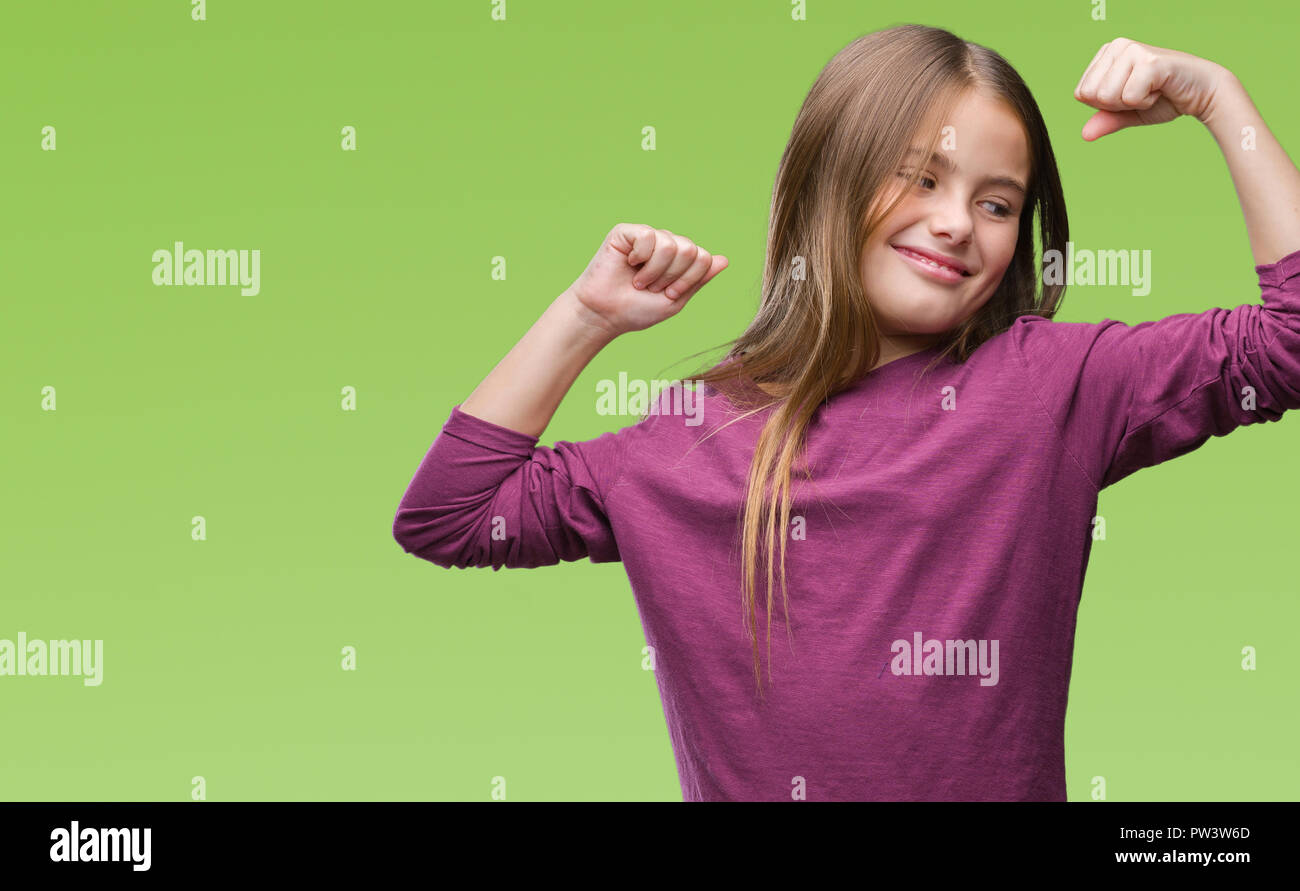 Young beautiful girl over isolated background showing arms muscles smiling proud. Fitness concept. Stock Photo