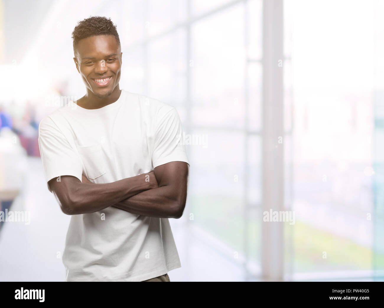 Young african american man wearing white t-shirt happy face smiling ...