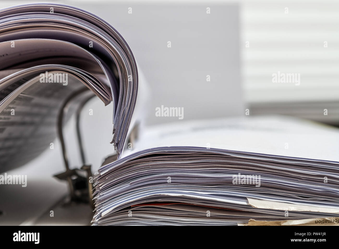 File folder with white paper on desk Stock Photo