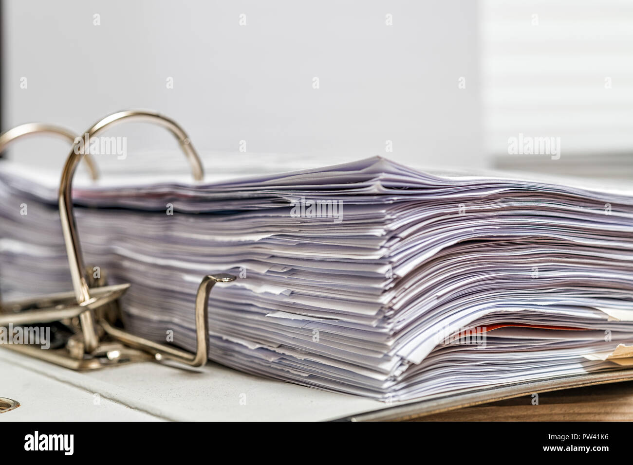 File folder with white paper on desk Stock Photo