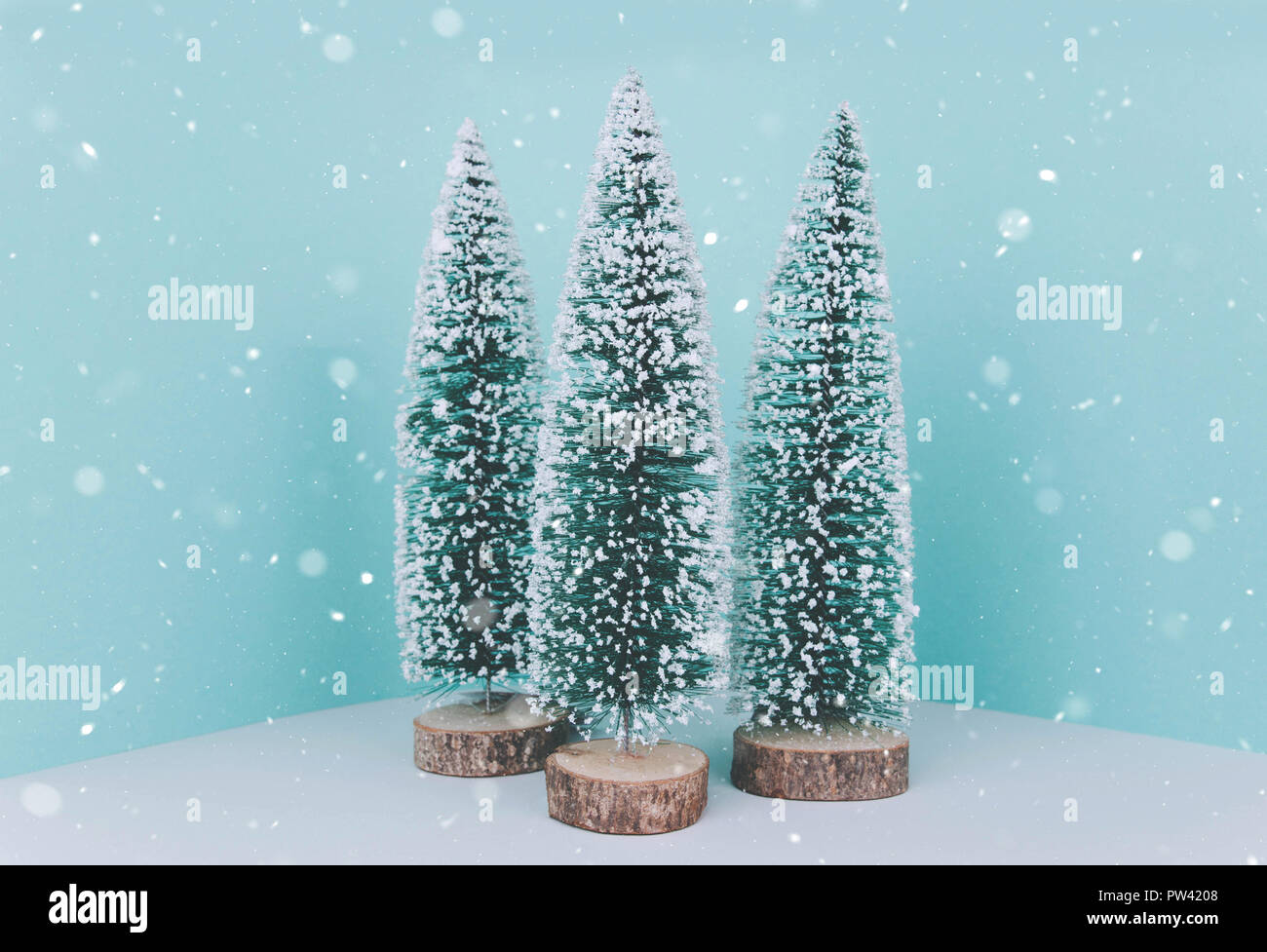 Christmas wooden tree over light blue background Stock Photo - Alamy