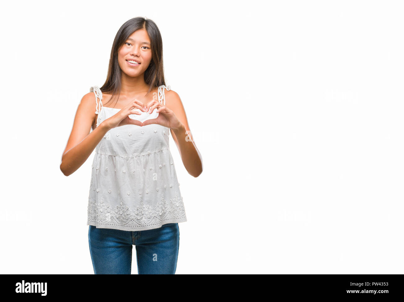 Young asian woman over isolated background smiling in love showing ...