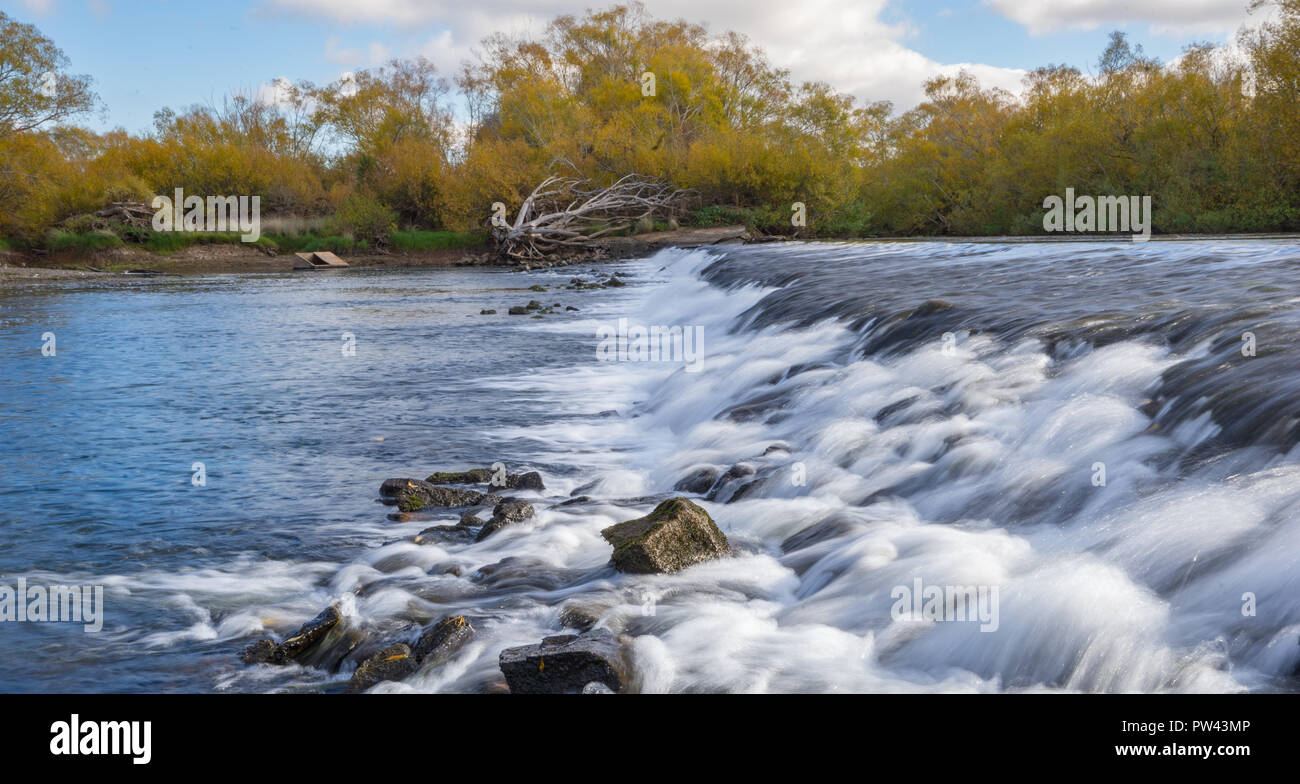 Longford Weir in Tasmania with lots of water flowing over it Stock